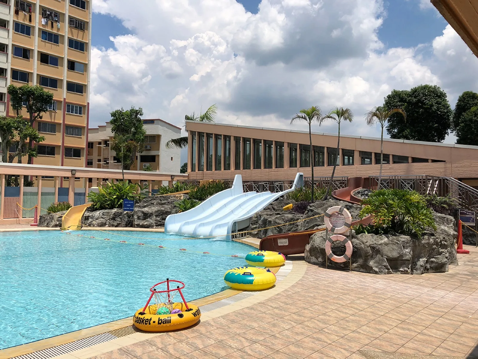 Wading pool with water slides and water play features for children at Yishun Swimming Complex